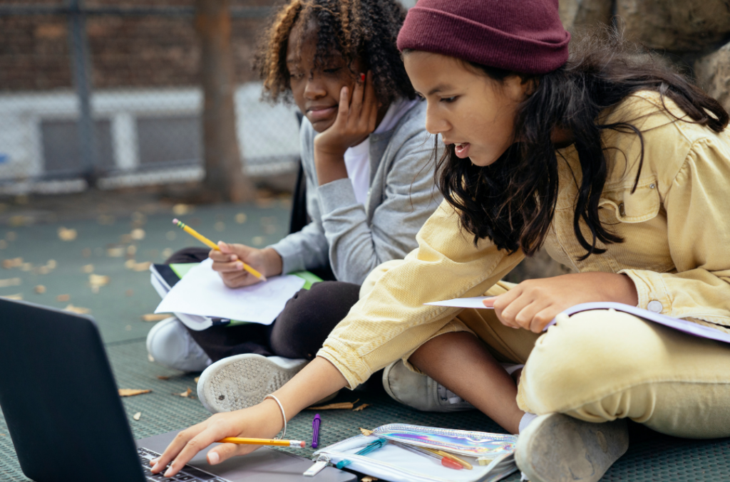 two teenage girls engaging in advocacy research