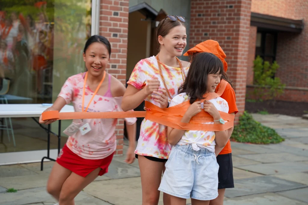 girls engaging in team and community building competitive games